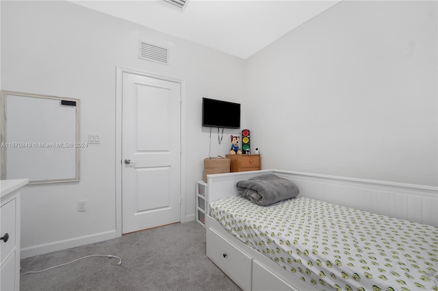 bedroom featuring light colored carpet