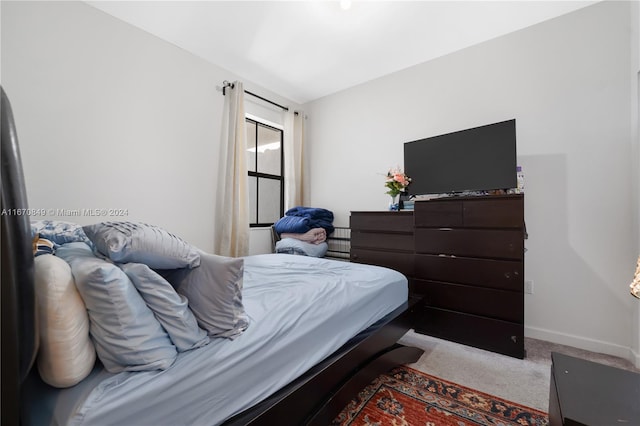 bedroom with light colored carpet