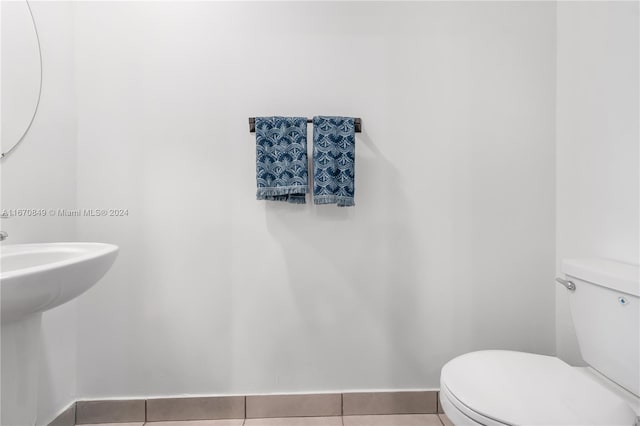 bathroom with tile patterned floors and toilet