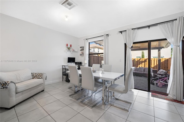 dining space with light tile patterned floors