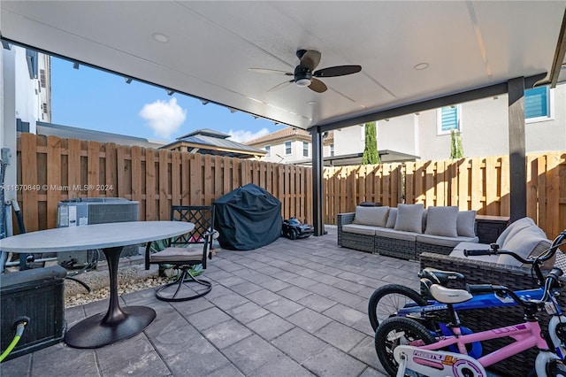 view of patio with outdoor lounge area, central air condition unit, and ceiling fan