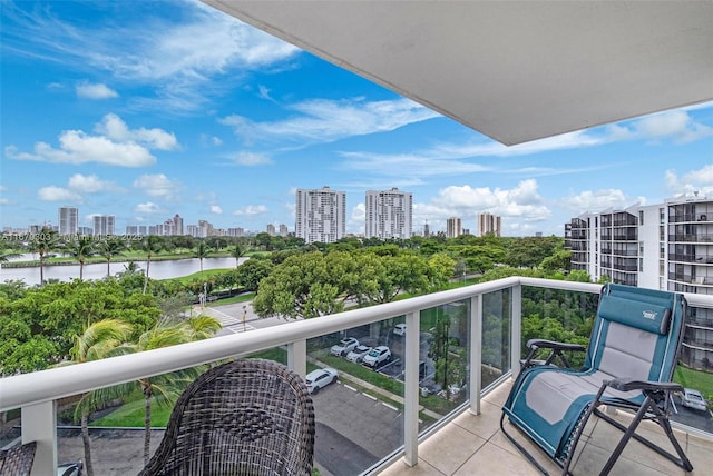 balcony with a view of city and a water view