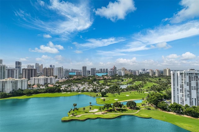 aerial view with a water view, view of golf course, and a view of city