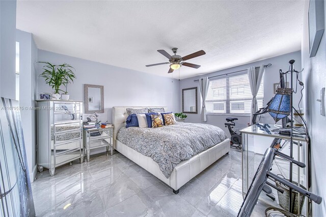 1101 SW 122nd Ave Unit 315, Miami, FL 33184 - bedroom featuring a textured ceiling and ceiling fan
