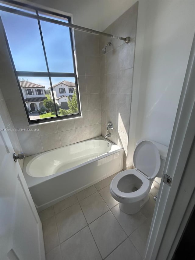 full bathroom featuring  shower combination, toilet, and tile patterned floors