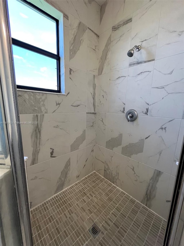 bathroom featuring a shower stall