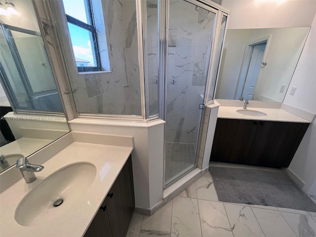 full bathroom with marble finish floor, a marble finish shower, two vanities, and a sink