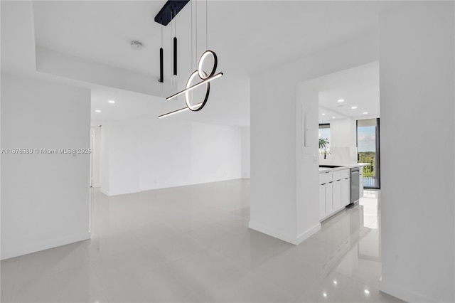 dining area featuring light tile patterned floors and sink