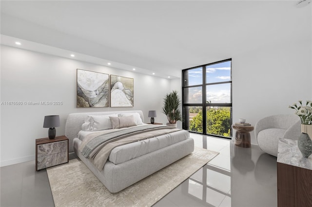 bedroom featuring floor to ceiling windows