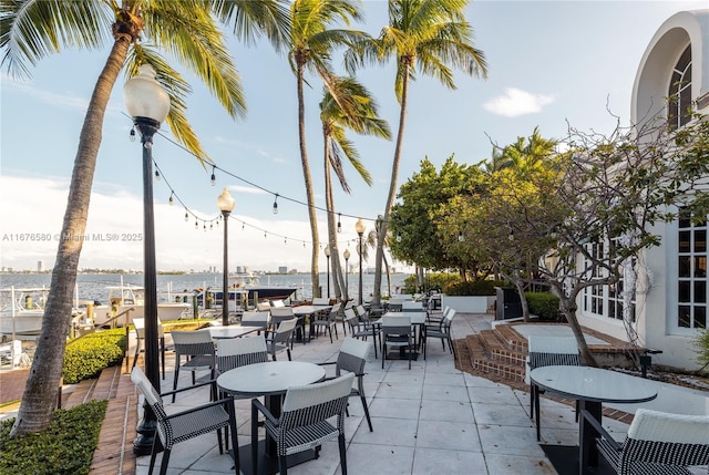 view of patio featuring a water view