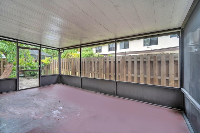 unfurnished sunroom with wooden ceiling