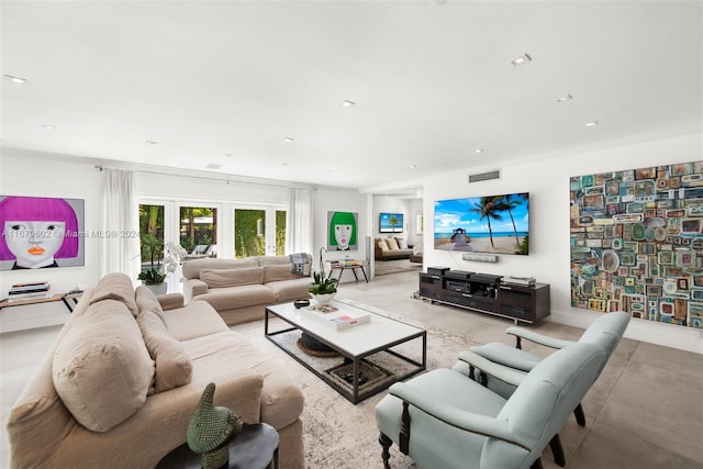 living room with french doors and crown molding