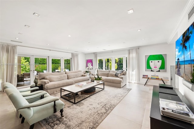 tiled living room with french doors and crown molding