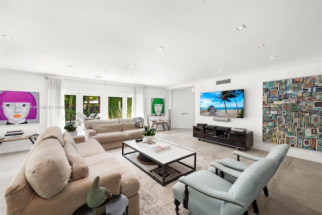 living room featuring french doors and ornamental molding