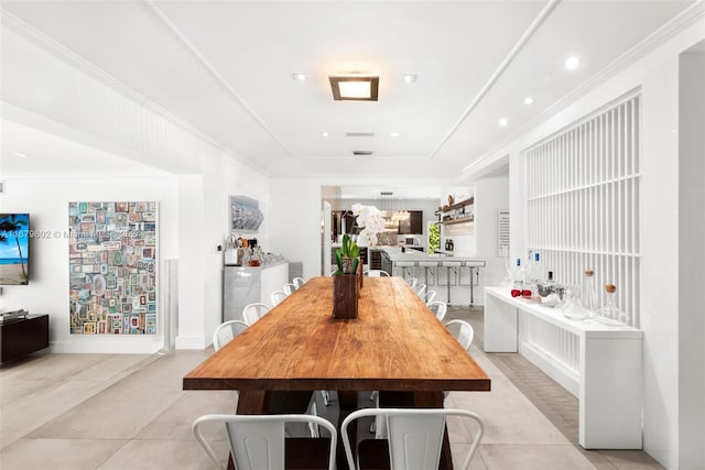 tiled dining space with crown molding