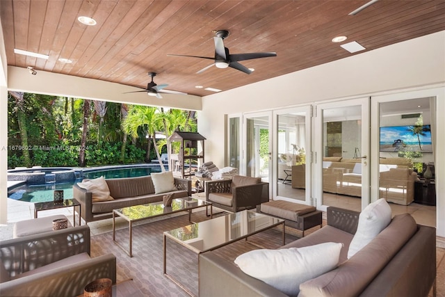 view of patio / terrace with french doors, ceiling fan, and outdoor lounge area