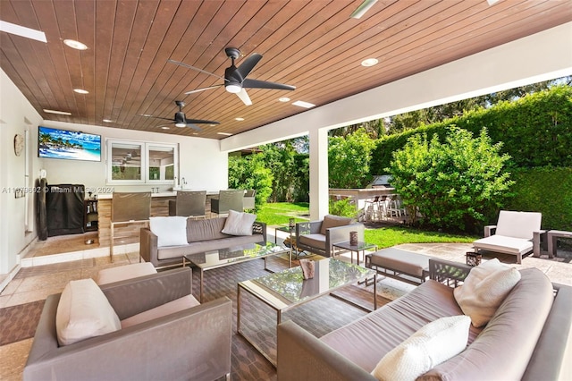 view of patio with outdoor lounge area and ceiling fan