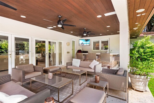 view of patio featuring french doors, outdoor lounge area, and ceiling fan