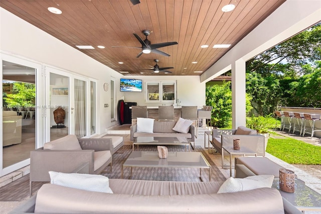 view of patio with ceiling fan and an outdoor hangout area