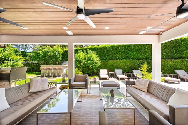 view of patio / terrace with an outdoor living space and ceiling fan