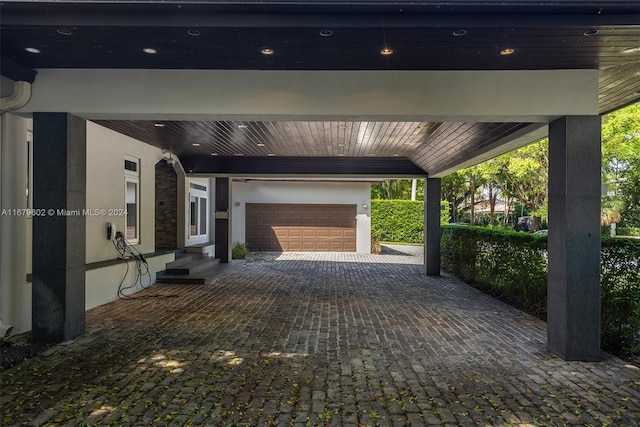 garage featuring a carport