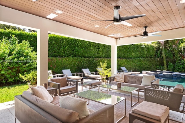 view of patio with a fenced in pool, an outdoor hangout area, and ceiling fan