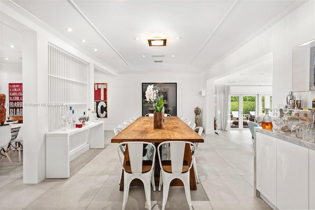 dining area featuring crown molding