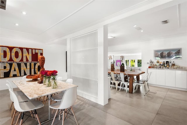 dining room featuring ornamental molding