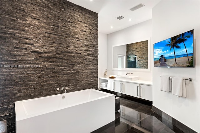 bathroom with vanity and a tub to relax in