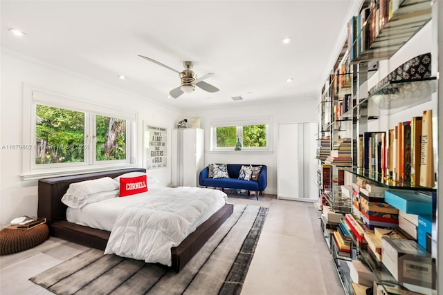 bedroom with multiple windows, crown molding, and ceiling fan