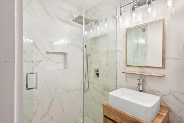 bathroom with vanity, tile walls, and an enclosed shower