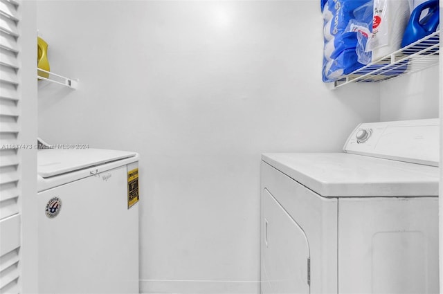 laundry area with separate washer and dryer