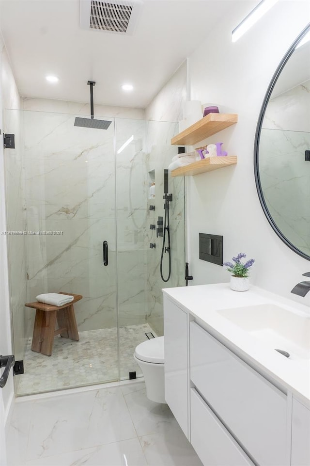 bathroom with vanity, toilet, and walk in shower