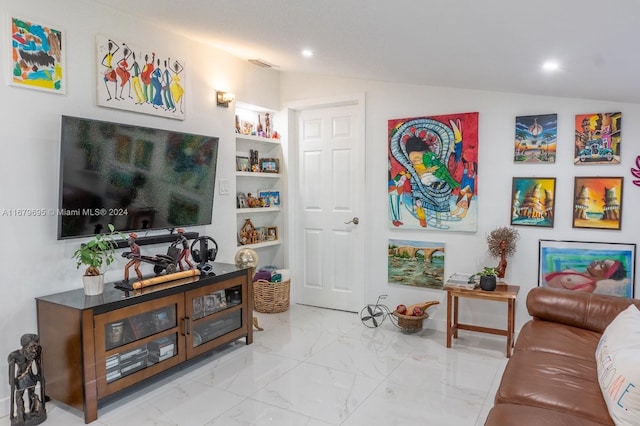 living room with vaulted ceiling and built in features