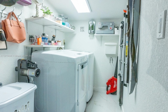 clothes washing area featuring washing machine and dryer