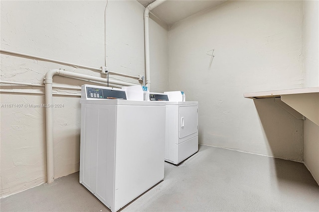 laundry room featuring washing machine and clothes dryer