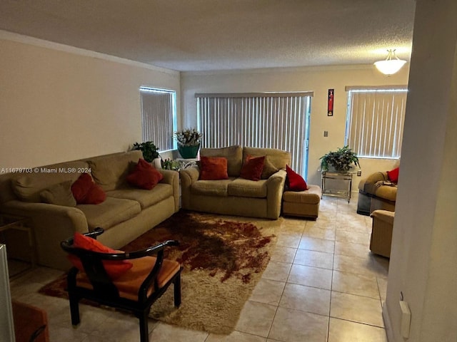 living room featuring a textured ceiling, light tile patterned floors, and ornamental molding