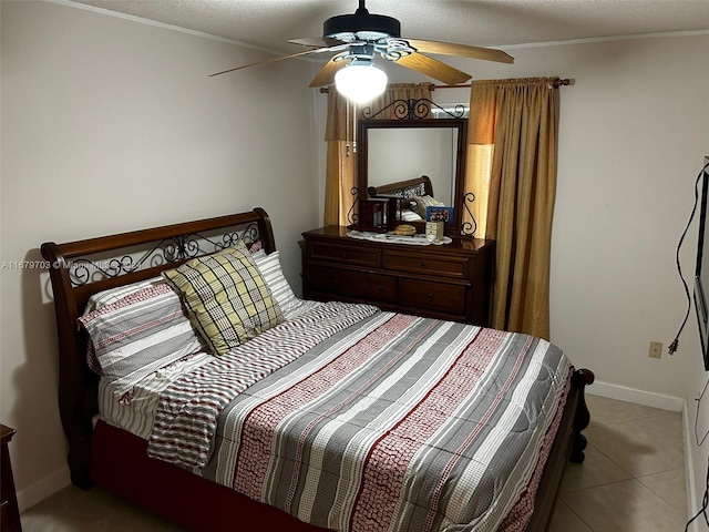 bedroom featuring ceiling fan, a textured ceiling, and light tile patterned floors