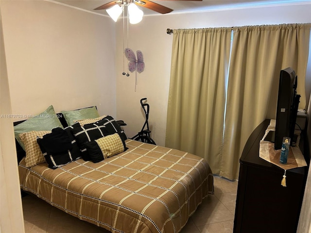 bedroom with tile patterned flooring and ceiling fan