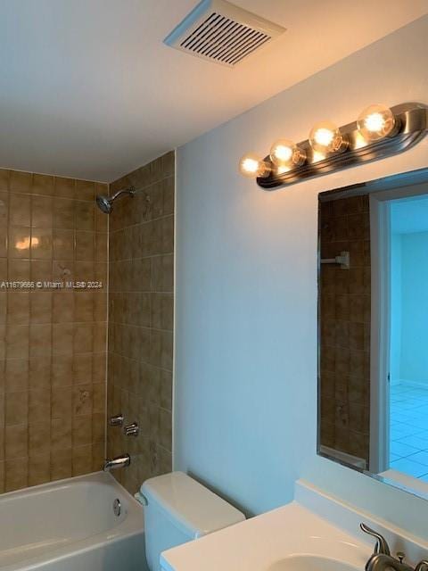 full bath with toilet, vanity, and bathing tub / shower combination