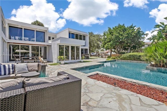 view of pool featuring a patio and an outdoor hangout area