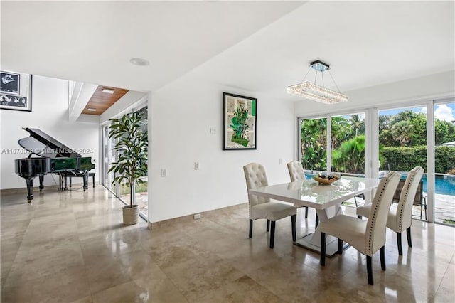 dining space featuring concrete floors