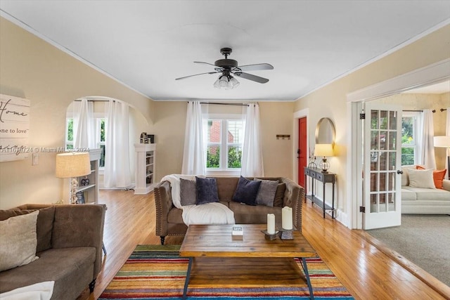 living room with light wood-type flooring and plenty of natural light