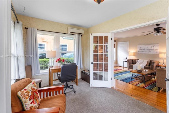 office with ceiling fan, french doors, a wall mounted AC, and wood finished floors