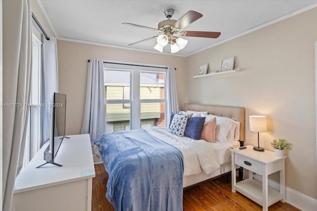 bedroom featuring ceiling fan, crown molding, and dark hardwood / wood-style floors