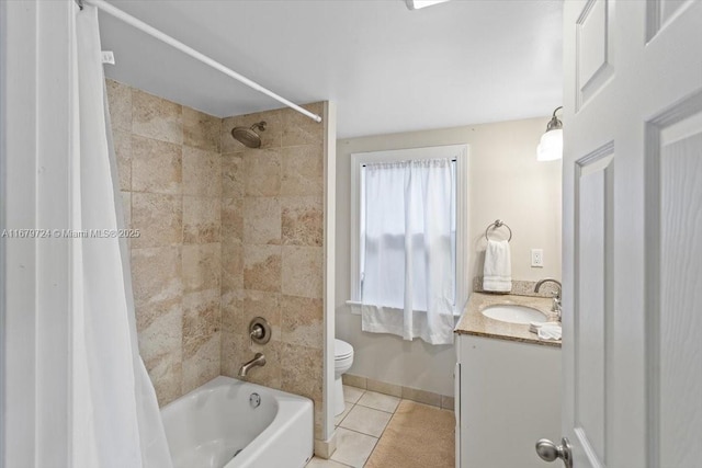 full bath with toilet, shower / tub combo, vanity, tile patterned flooring, and baseboards