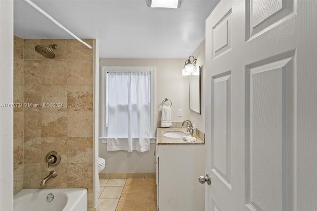 full bathroom with toilet, tiled shower / bath combo, vanity, and tile patterned flooring