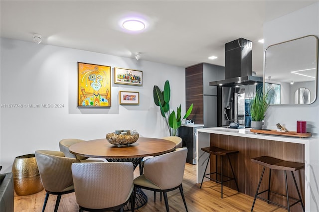 dining space featuring light hardwood / wood-style floors