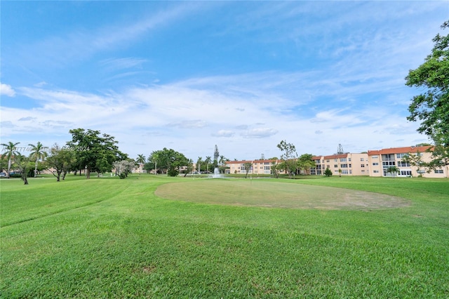 view of home's community featuring a lawn