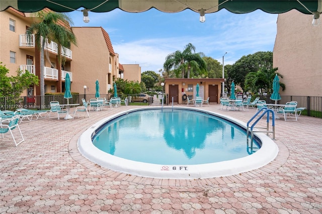 view of swimming pool featuring a patio area